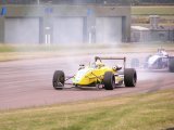 Thruxton 17/08/2003: Andrew peering through tyre smoke into Campbell