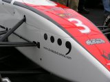 Donington 04/04/2004: The car in the garage with logo close-up