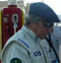 Jackie Stewart demonstrating the laughable headgear drivers were sporting in his day, young man.